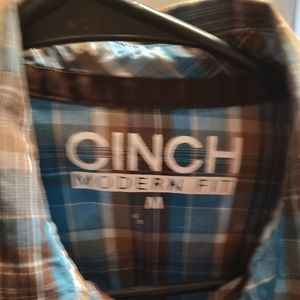 Medium long sleeve cinch pearl snap .